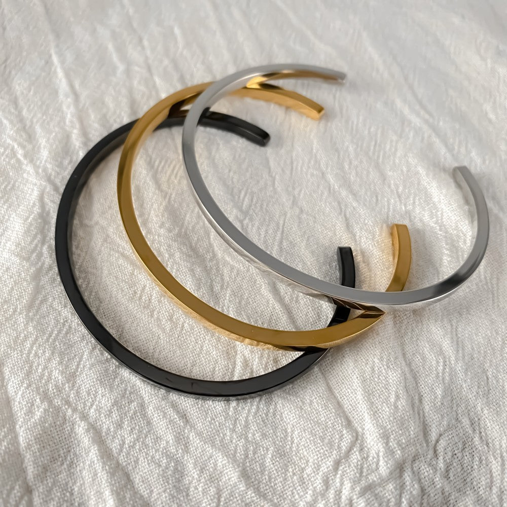 Slim Cuff - gold, silver and black cuffs on fabric