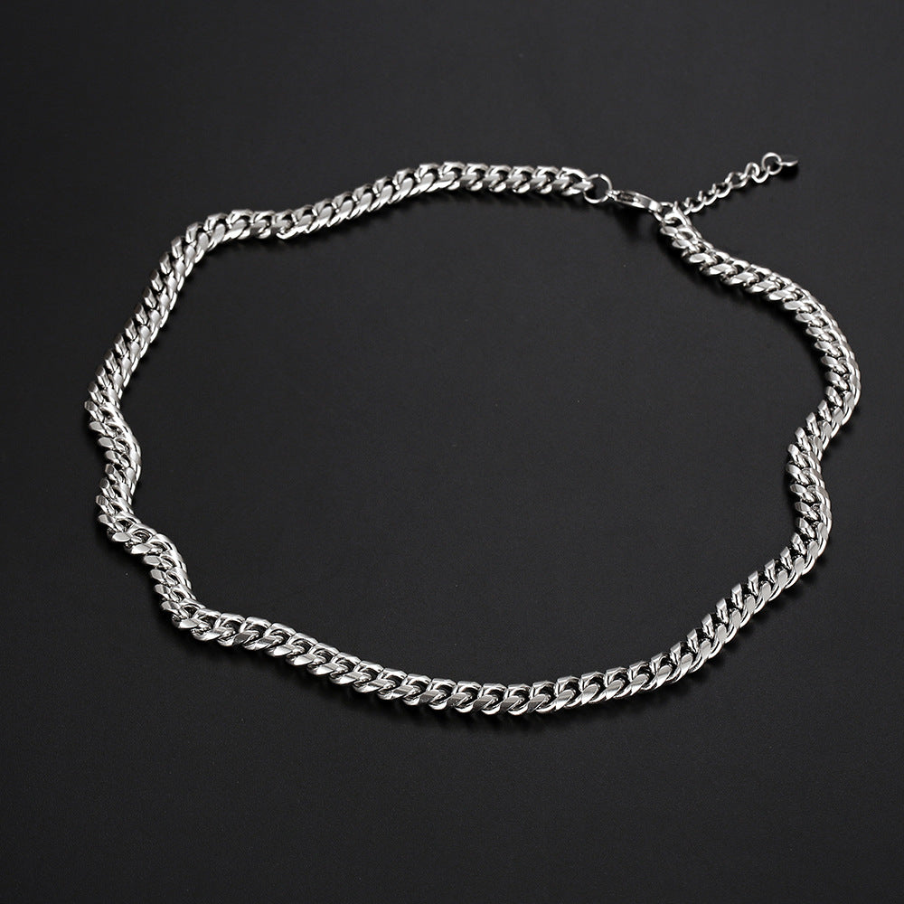 Curb Chain 8mm - chain laid flat on dark background