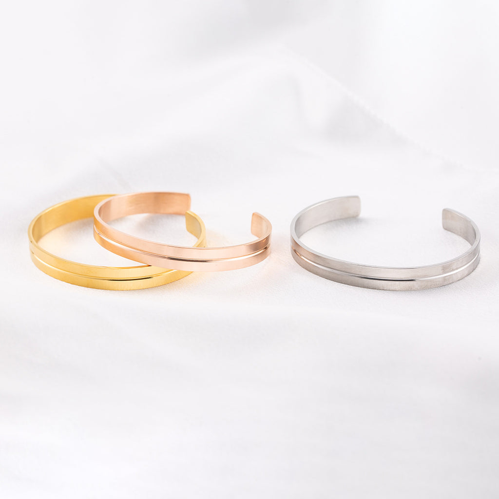 Groove Cuff - cuffs on white fabric