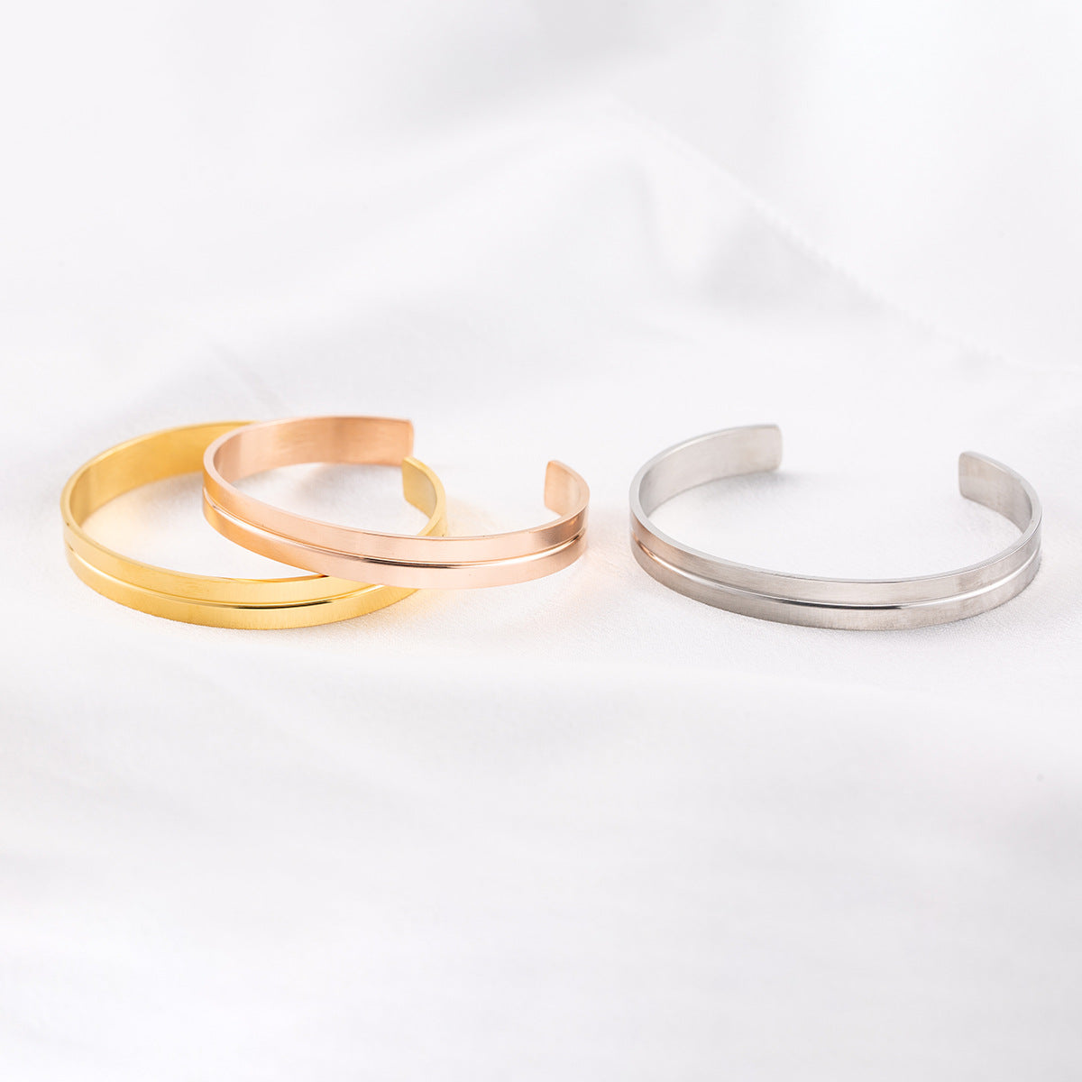 Groove Cuff - cuffs on white fabric