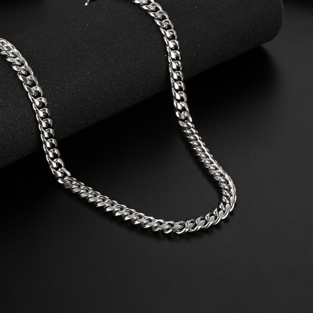 Curb Chain 8mm - chain draped on dark background