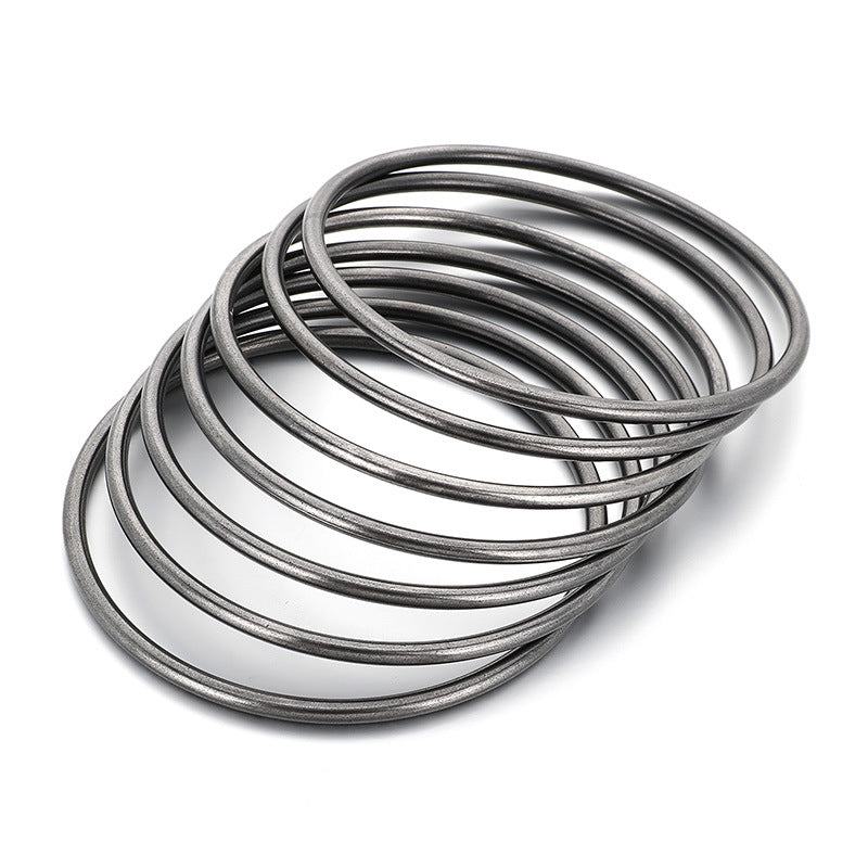 Noir Bangle - stacked black bangles on white background